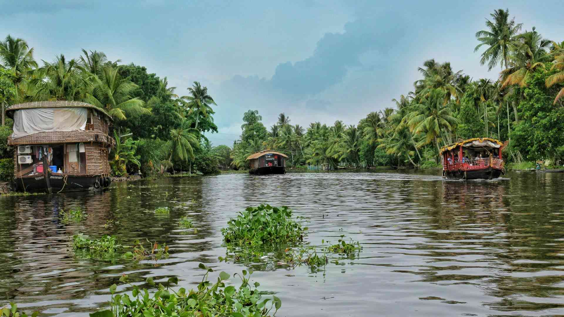 Houseboat on a body of water in Kerala Backwaters, India