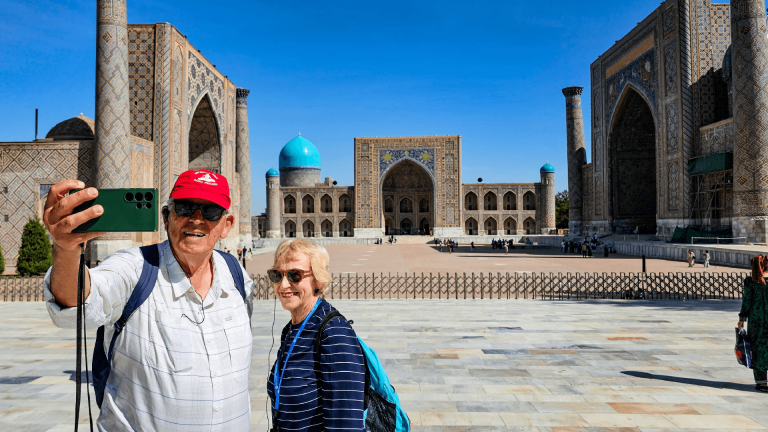 Two Bunnik Tours travellers in front of Samarkand in Uzbekistan by Dennis Bunnik