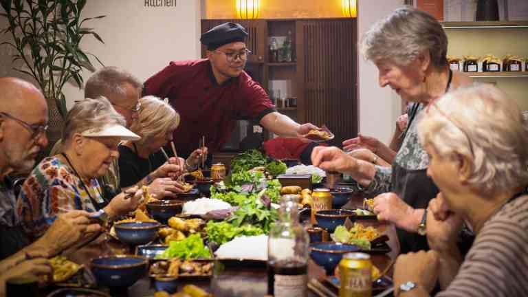 A group of people eating Vietnamese food on a Bunnik Tour