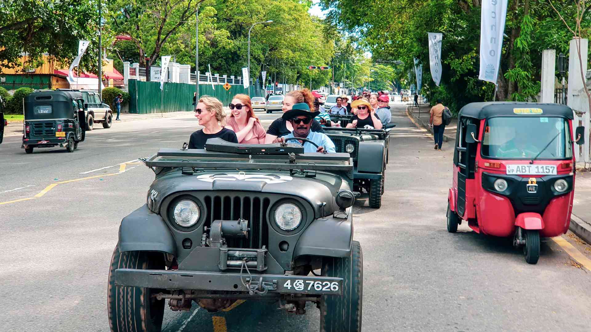 People in an open-top Jeep driving around Colombo, Sri Lanka on a Bunnik Tour