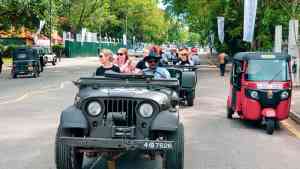 People in an open-top Jeep driving around Colombo, Sri Lanka on a Bunnik Tour