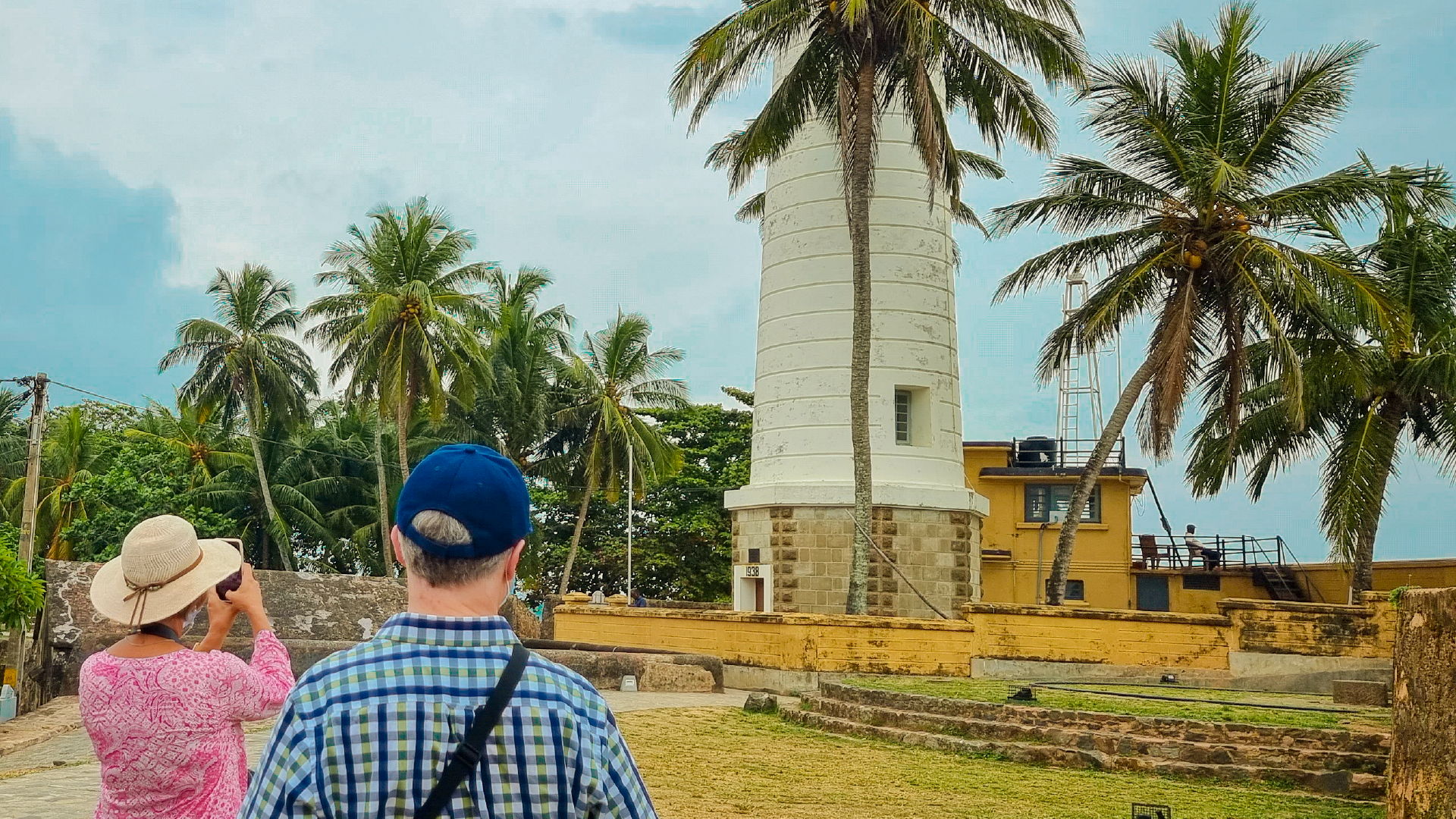 Two travellers standing outside Galle lighthouse in Sri Lanka on a Bunnik Tour