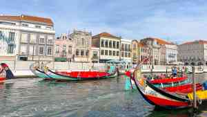 A canal with boats in it in Aveiro, Portugal