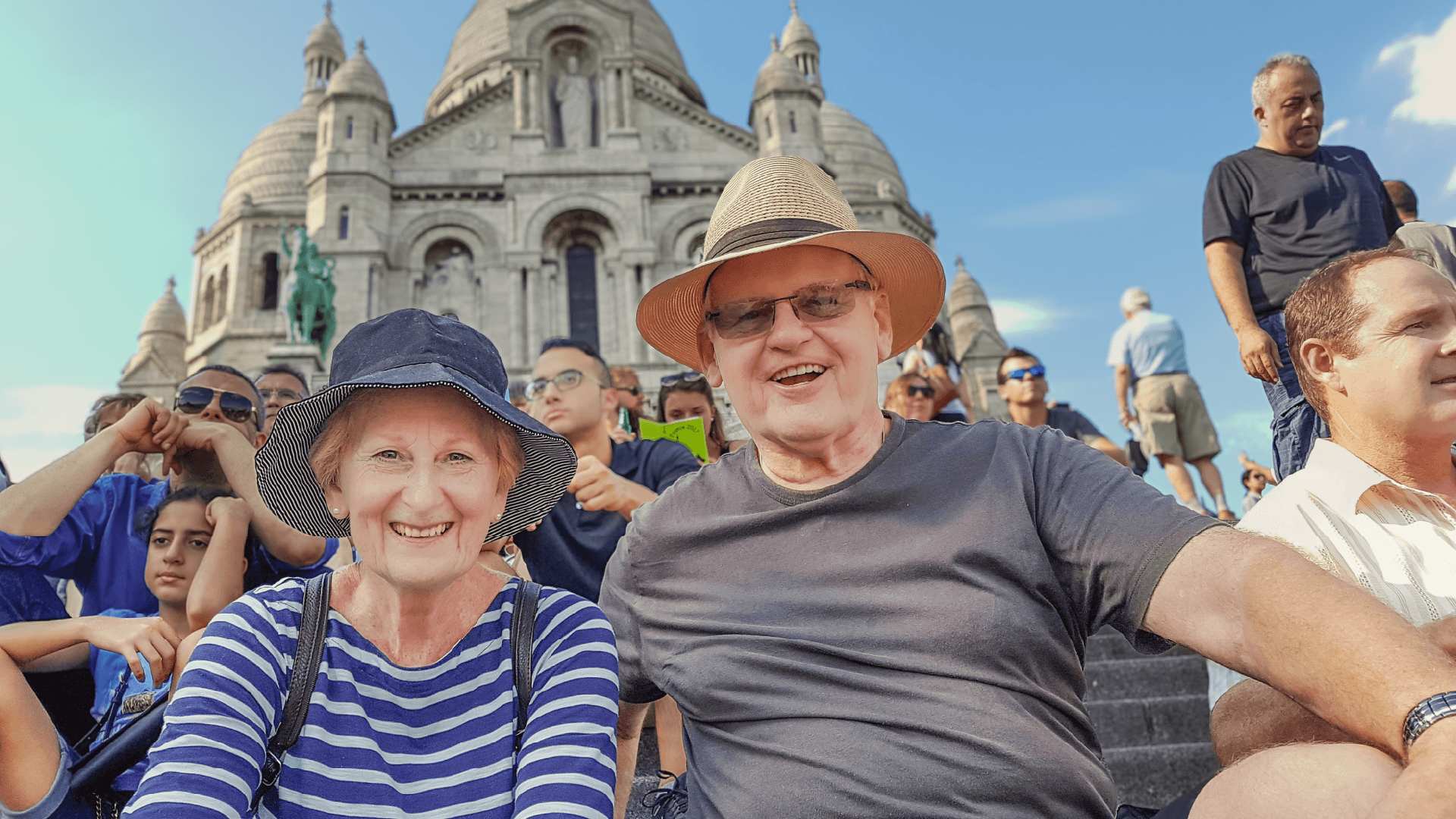 A couple sitting in Paris on a Bunnik Tour of France