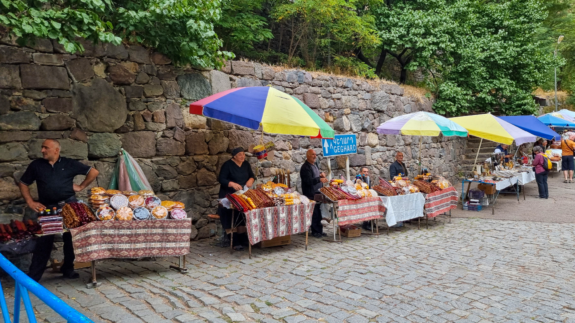 Local food stalls scattered along the streets of Geghard, Armenia captured by Dennis Bunnik