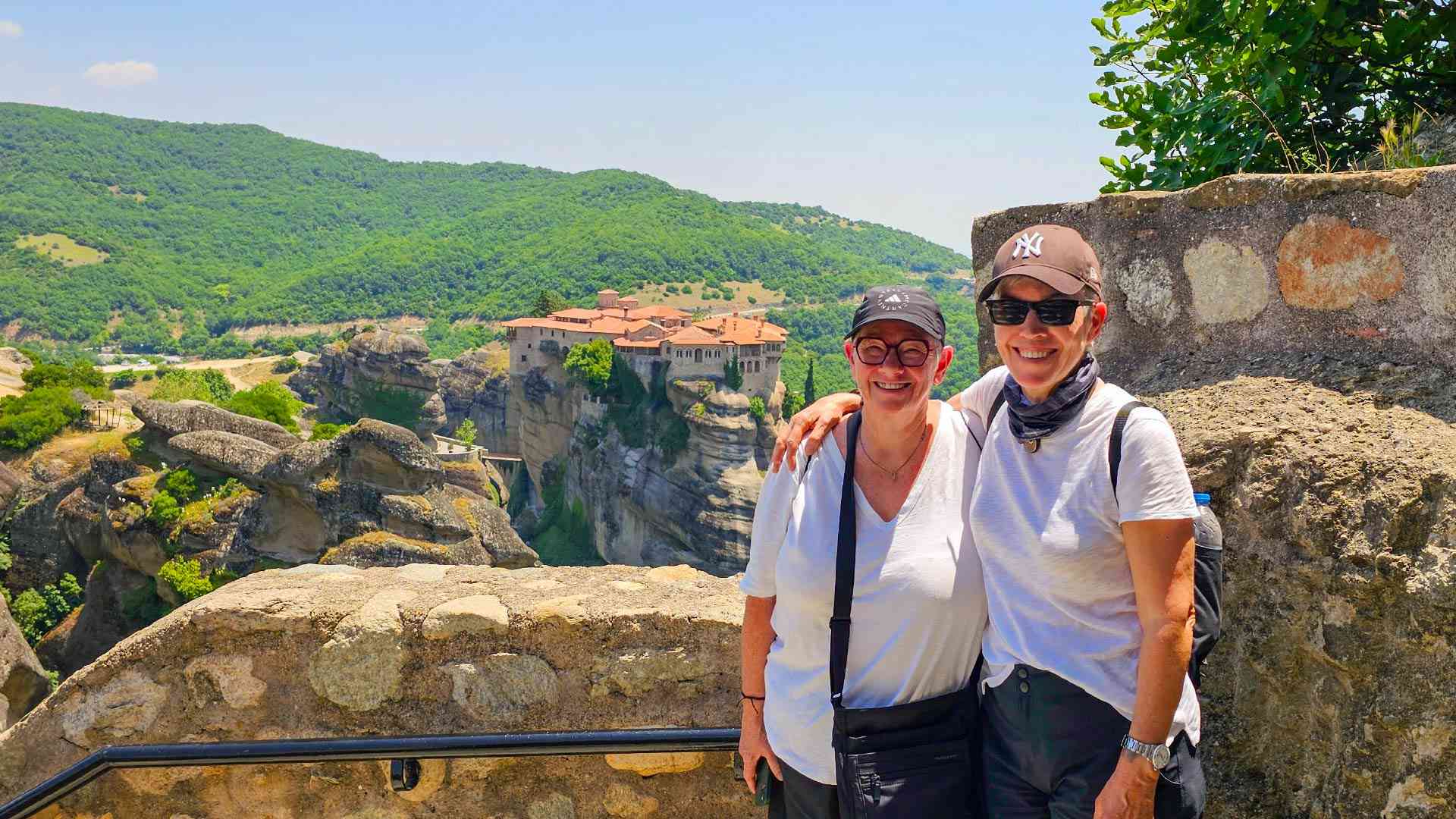 Two women standing at Meteora on a Bunnik Tour of Greece