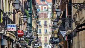 Buildings on narrow street in San Sebastian, Spain by Dennis Bunnik