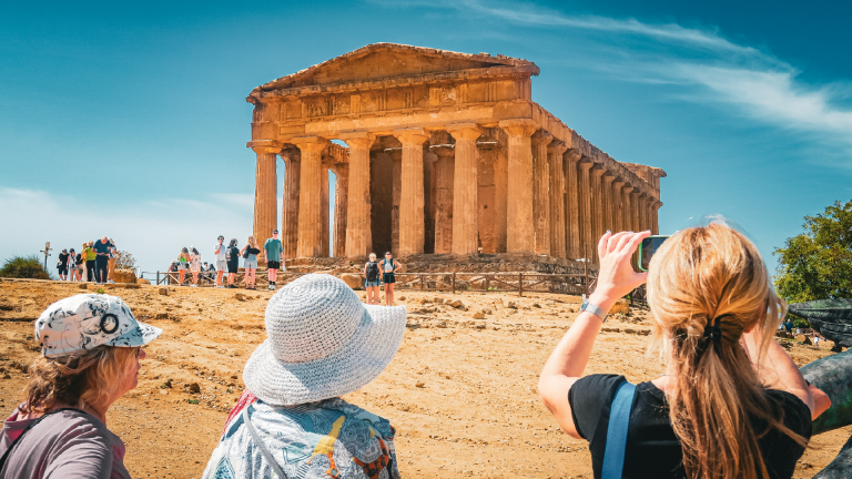 People taking pictures of the Valley of Temples in Agrigento, Sicily, Italy by Amie Bunnik