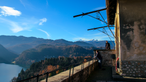 People looking out over Lake Bled, Slovenia by Hera Sparnon