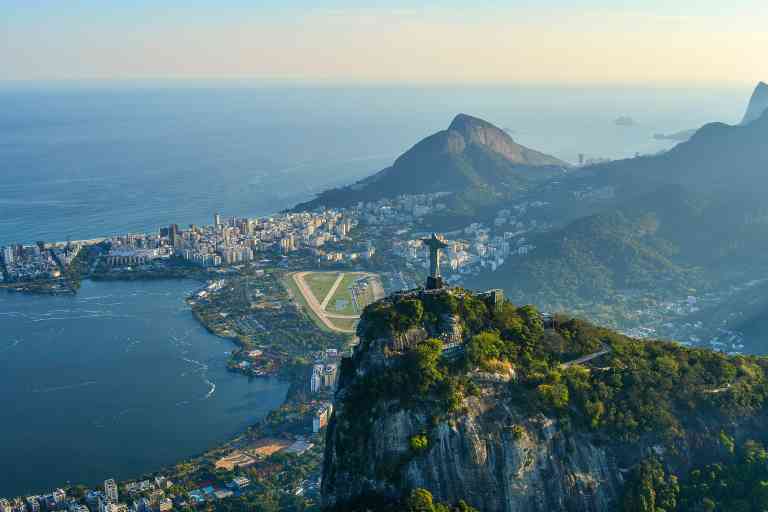 Aerial view of Rio de Janeiro city skyline with Christ the Redeemer statue on a Brazil tour
