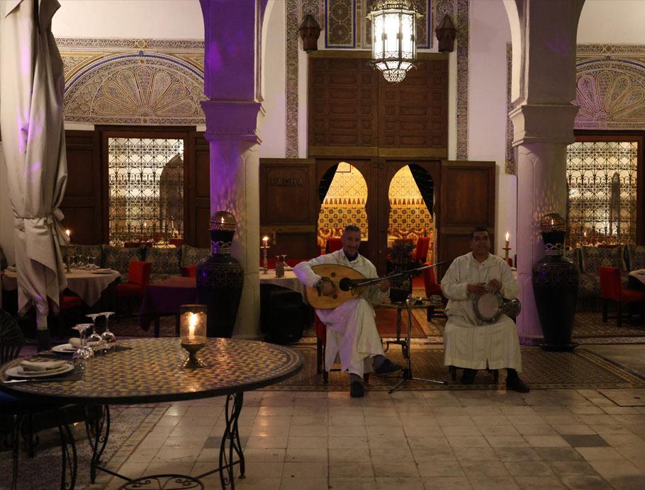 Traditional Moroccan musicians within a Moroccan restaurant