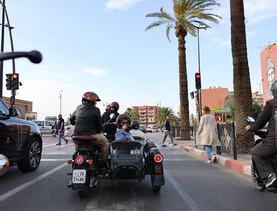 Motorbike and sidecar stopped at a traffic light on a Moroccan boulevard