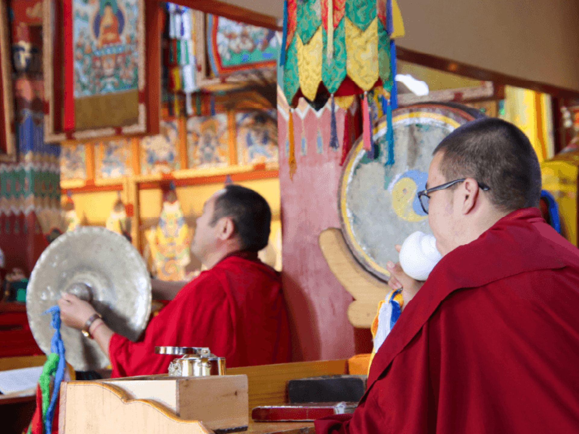 Monks horn blowing and clashing symbols together in the Erdenzuu Monastery in Mongolia