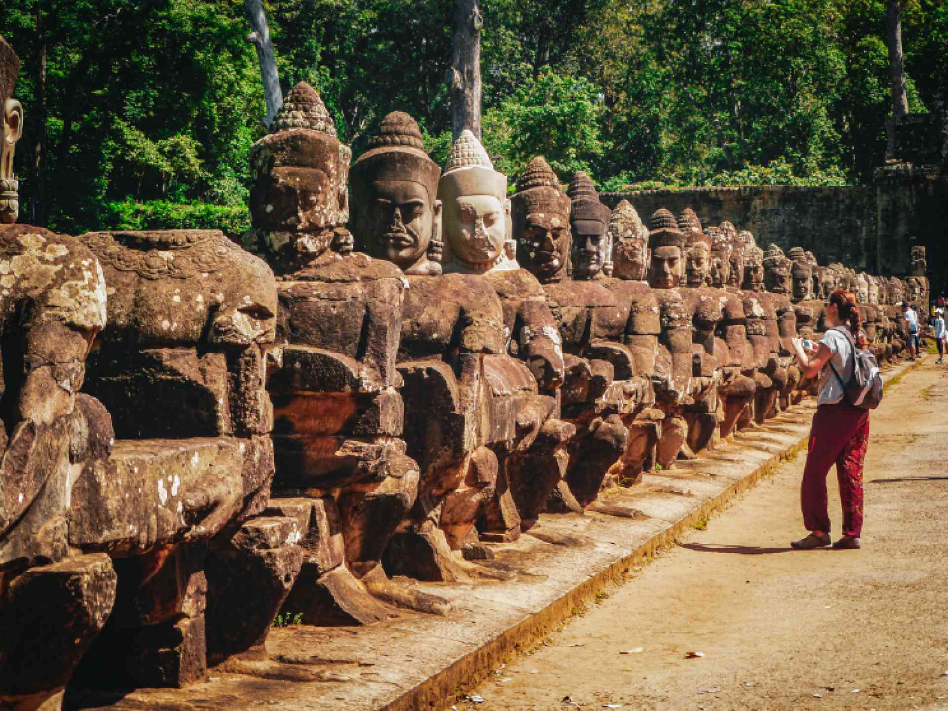Woman taking a photo in Angkor Wat on a Bunnik Tour of Cambodia