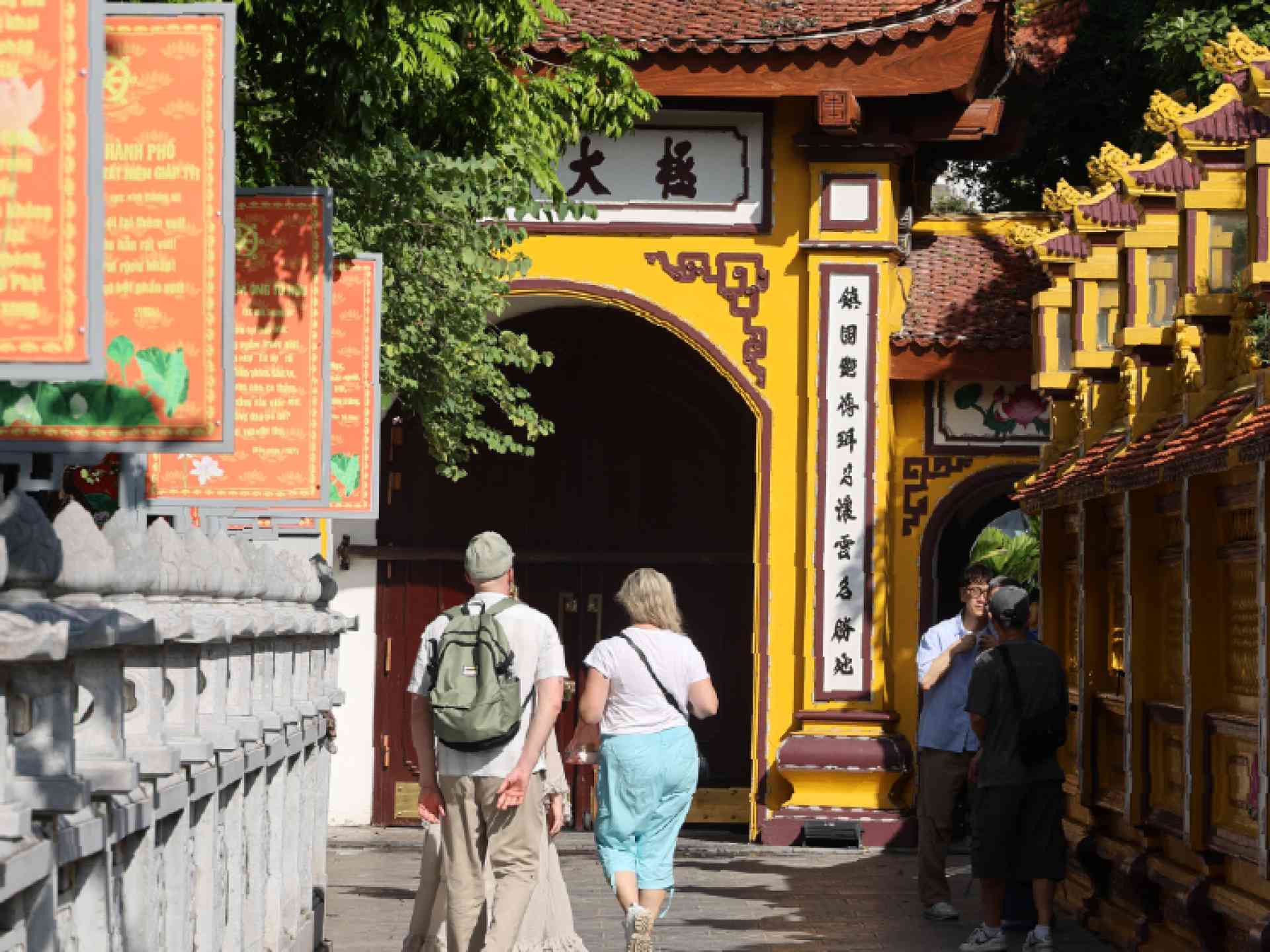 People walking in Trấn Quốc Pagoda in Hanoi on a Bunnik Tour of Vietnam